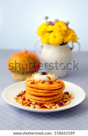 Pumpkin pancakes with walnuts and cranberries