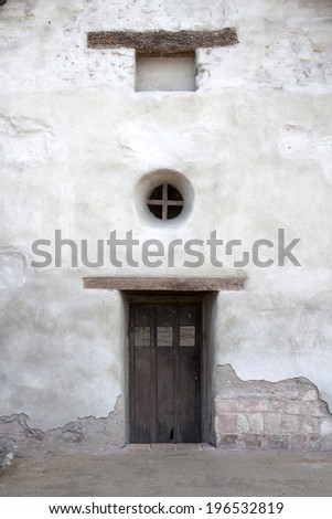 Door and round window, California Mission San Juan Capistrano