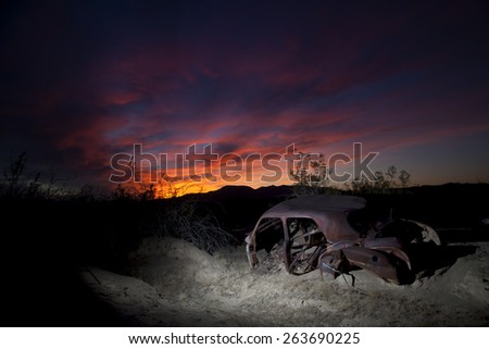Abandoned vintage auto in the desert, with gorgeous sunset, Joshua Tree National Park