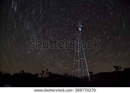 Windmill centered on north star with comet trails, Joshua Tree National Park