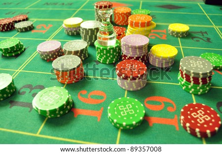 image with a casino roulette table layout with chips and dolly