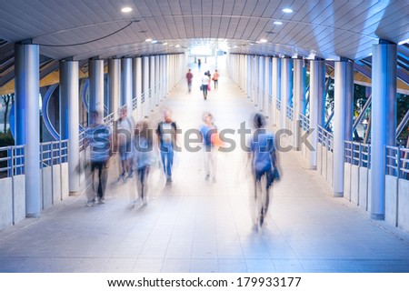 Walk into the light. blurred view of people walking