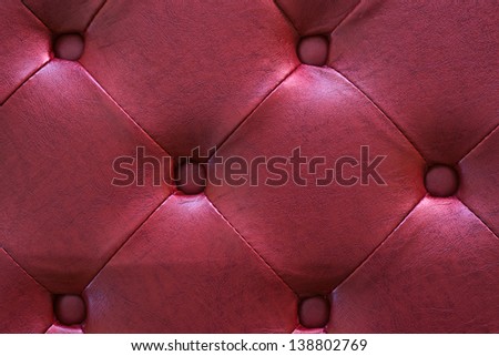 Photo of red classic leather texture as abstract background top view