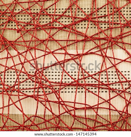 Cloth mat covered with the red threads as abstract background composition