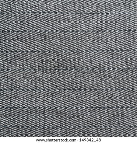 Striped black and white cloth material fragment as a texture background