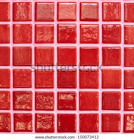 Wall tiled with red glazed tiles fragment as an abstract background