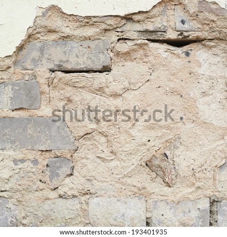Brick wall with the whitewash falling off fragment as a background texture