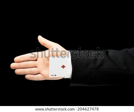 Caucasian male hand in a business suit holding the ace playing card in the sleeve low-key lighting composition, isolated over the black background