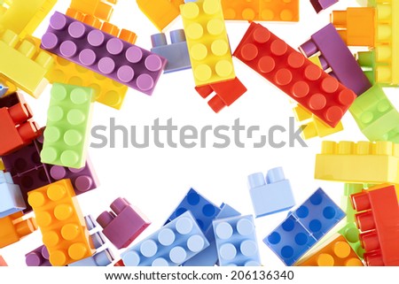 Copyspace background composition made of toy construction brick blocks against the white backdrop