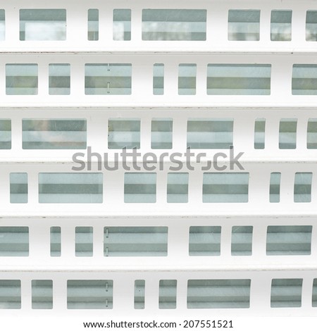White metal shopwindow blind\'s fragment as an abstract background composition
