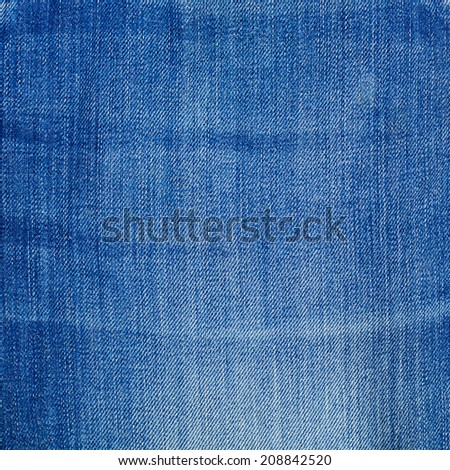 Wrinkled jeans blue denim cloth fragment as a background texture composition