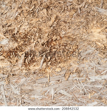 Surface made of pressed wooden shavings as an abstract background composition