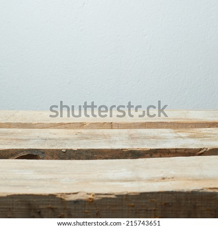 Workshop space made of wooden boards against the gray wall, shallow depth of field composition