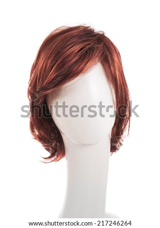 Wavy hair wig over the white plastic mannequin head isolated over the white background