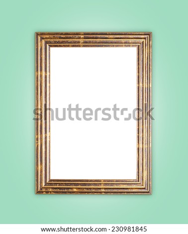 Copyspace empty wooden picture frame composition over the green surface as a background clip-art composition