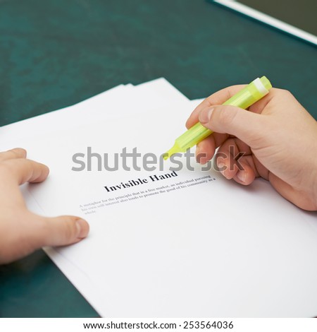 Marking words in an invisible hand definition, shallow depth of field composition