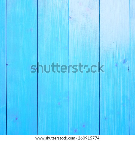 Blue paint coated wooden pine boards lying in a row as a close-up background composition