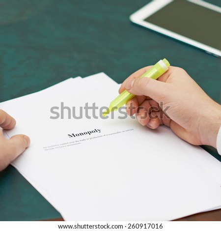 Marking words in a monopoly definition, shallow depth of field composition