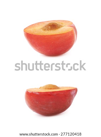 Cut open half of a red victoria plum isolated over the white background, set of two different foreshortenings