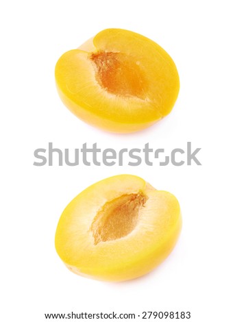 Cut open half of a yellow mirabelle plum isolated over the white background, set of two different foreshortenings
