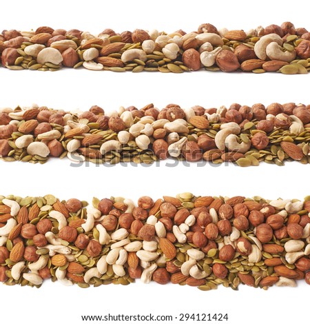 Line border made of multiple different nuts and seed mix, composition isolated over the white background, set of three different foreshortenings
