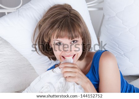 Portrait of a woman relaxing on her bedroom