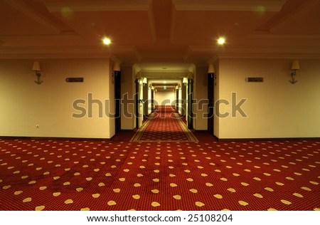 Corridor with red carpet in an expensive hotel