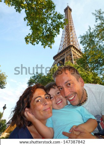 Happy family in Paris holidays. Eiffel Tower
