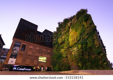 MADRID, SPAIN-AUGUST 31: Caixa Forum on August 31, 2013 Madrid. Caixa Forum Madrid is a museum and cultural center. It is sponsored by La Caixa. Facade of plants by botanist Patrick Blanc.