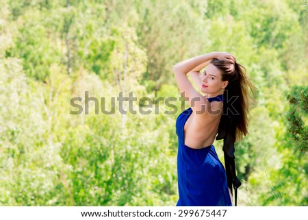 portrait photo aristocrat in a sunny summer green forest