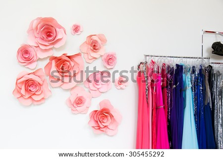 Dress shop with evening dresses on hangers