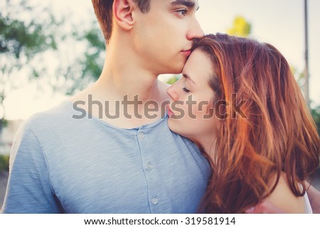 Sad woman hugging her boyfriend couple problems concept