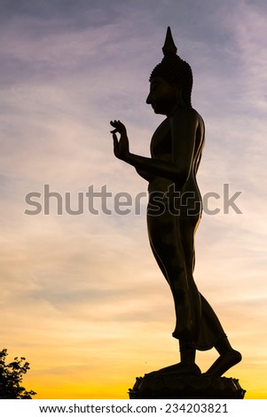 Big buddha silhouette on sunset