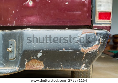 A car has a dented rear bumper after an accident/Damage/Car Accident
