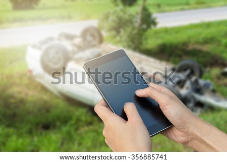 woman hand hold and touch smart phone,cell phone,mobile over blurred image of broken black car : calling mechanic service from repair shop and insurance concept