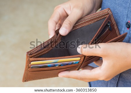 business person holding an empty wallet