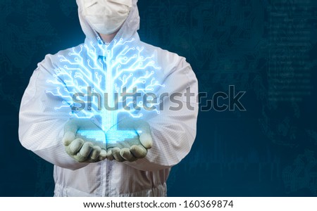 Engineer in working suit showing glow circuit tree