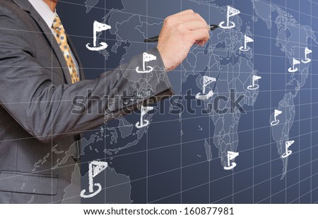 male sketching flag on world map concept of world wide business