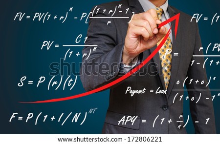 businessman draw up trend line and financial formula