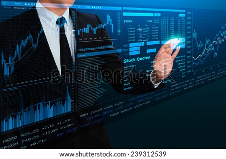 businessman trading stock by futuristic screen interface