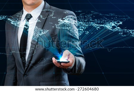 businessman using smart phone making global connection