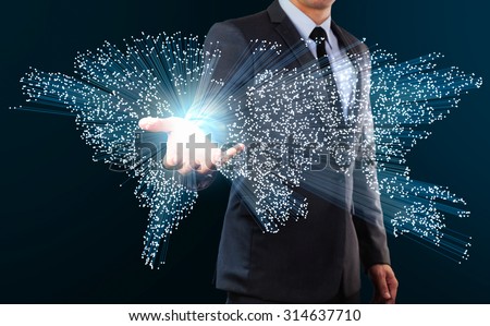 businessman showing blue fiber optics cable forming to world map