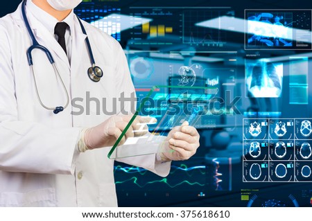 doctor using hi-tech transparency tablet  in operating room