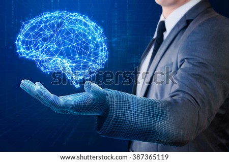 businessman with wire frame hand holding glow abstract brain structure