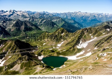 PIC DU MIDI, FRANCE - AUGUST 22: The Oncet Lake at the foot of the Midi de Bigorre peak (2872m) has an area of ??6.7 ha and a depth of 16m. August 22, 2013 in Pic du Midi, France