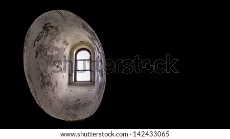 Small window in at the end of a shaft of a thick stone wall