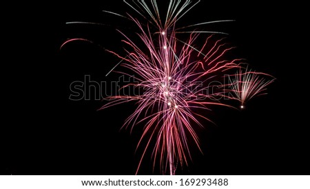 Fireworks on black background. Can be used as an effect to add fireworks to an existing image by putting it on a layer on top and \