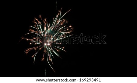 Fireworks on black background. Can be used as an effect to add fireworks to an existing image by putting it on a layer on top and \