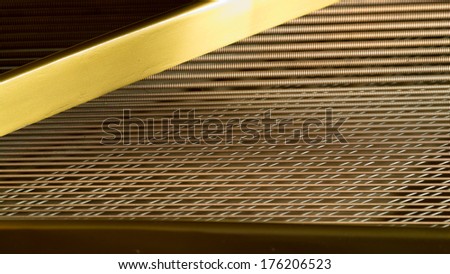 Grand piano strings. optical illusion as the strings become larger the farther away they are the image appears to be taken from below the strings