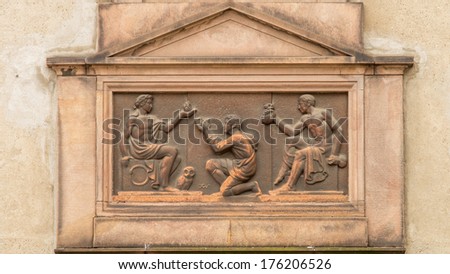 Art Deco inspired classical relief of a common man receiving fire, wisdom and wealth from greek/roman inspired gods